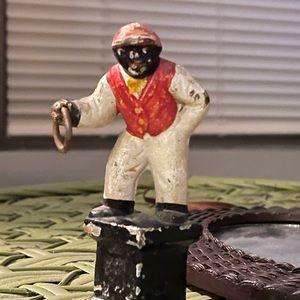 African jockey door stop , cast iron, needs touched up